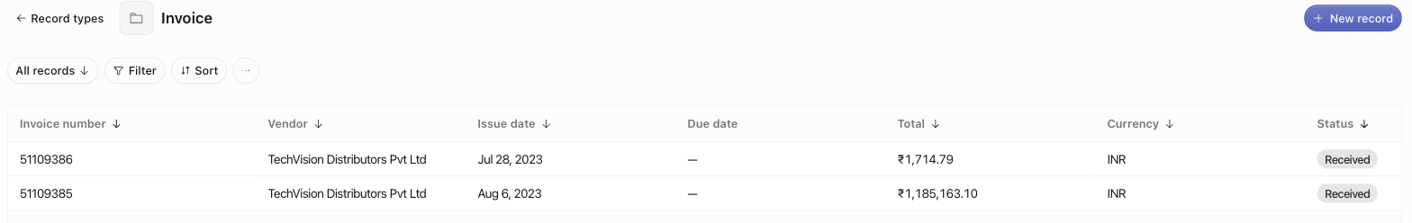 The Invoice records table with the Invoice number title column pinned to the left, the view toolbar above it, and a New record button