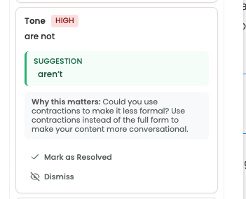 Expanded issue card showing the click-to-apply suggestion text in the body and the Mark as Resolved and Dismiss (X) controls in the footer.