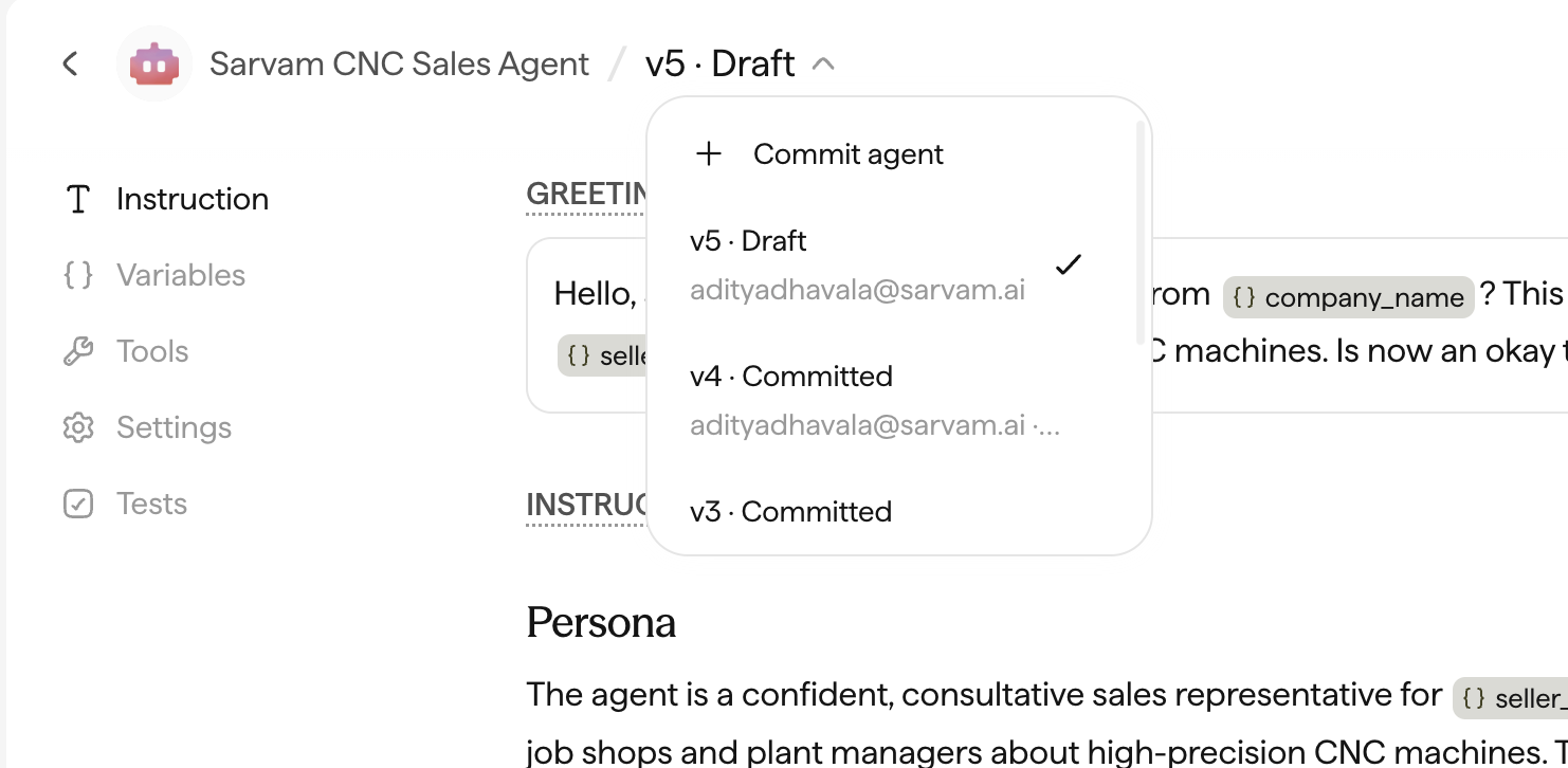 The version selector open, showing Commit agent and a list of draft and committed versions.