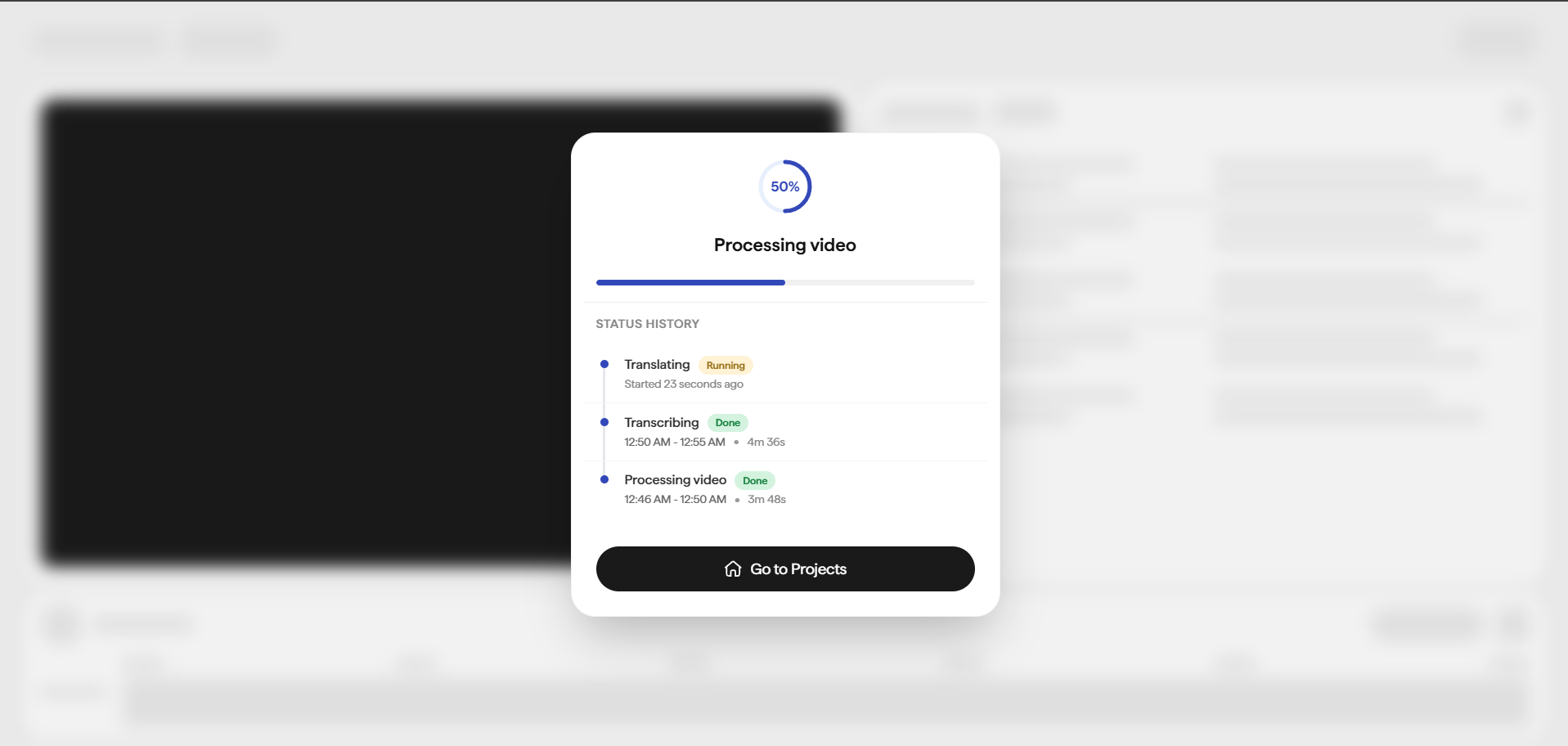 Processing video dialog showing a 50 percent circular progress indicator, a linear progress bar, and a Status History timeline listing pipeline stages: Translating (Running, started 23 seconds ago), Transcribing (Done, with start and end times and duration), and Processing video (Done, with start and end times and duration). A Go to Projects button sits at the bottom.