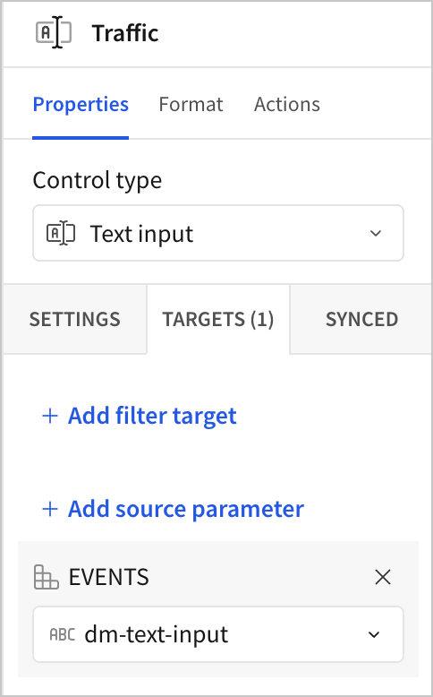 The Properties panel for a Traffic text input control with the EVENTS data model added as a source parameter and the dm-text-input control ID selected.