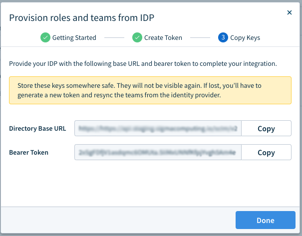 The Copy Keys step of the provisioning modal showing the Directory Base URL and Bearer Token fields with Copy buttons and a warning that the keys won't be visible again.