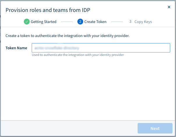The Provision roles and teams from IDP modal on the Create Token step, with a Token Name field and a Next button.